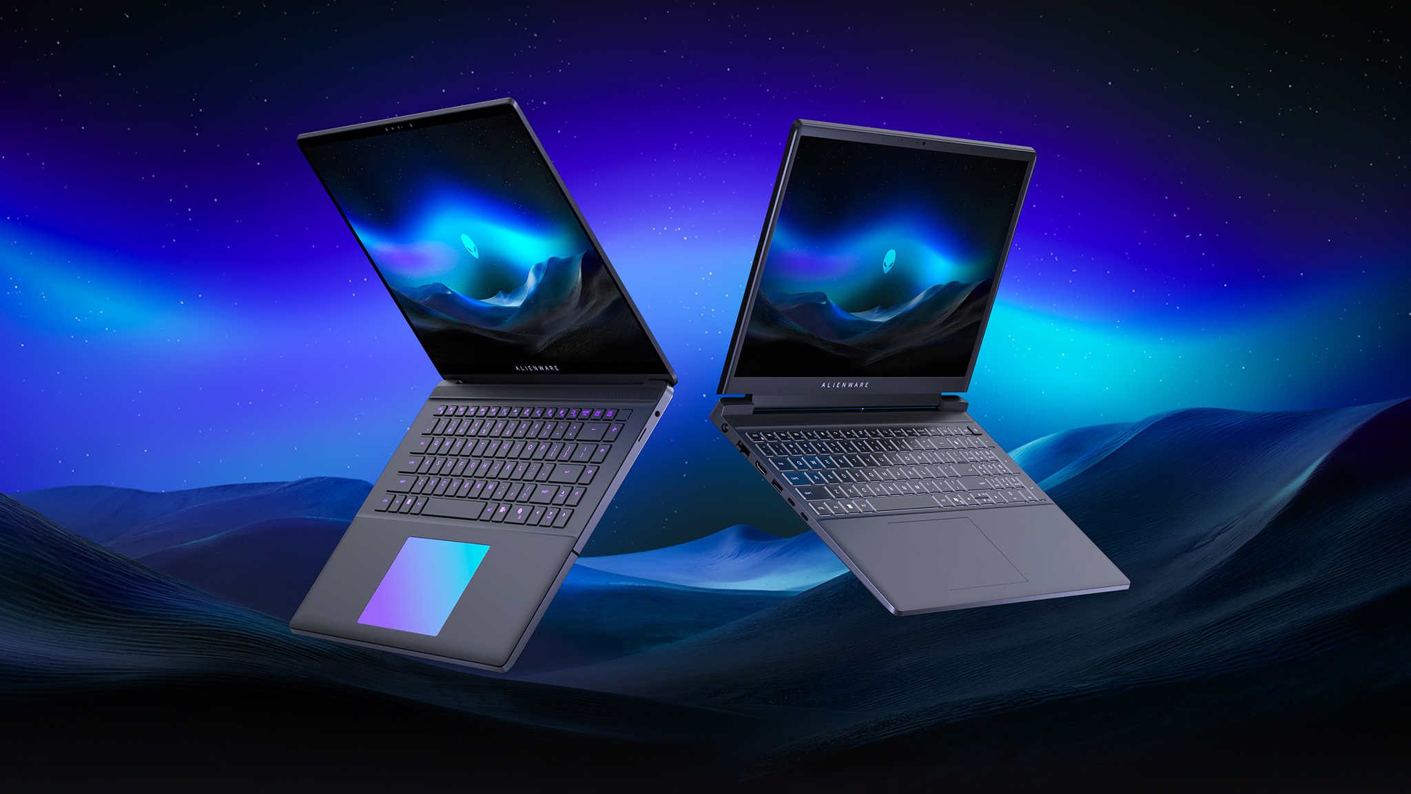 Alienware's two new entry-level and ultra slim gaming laptops floating in front of a landscape background.