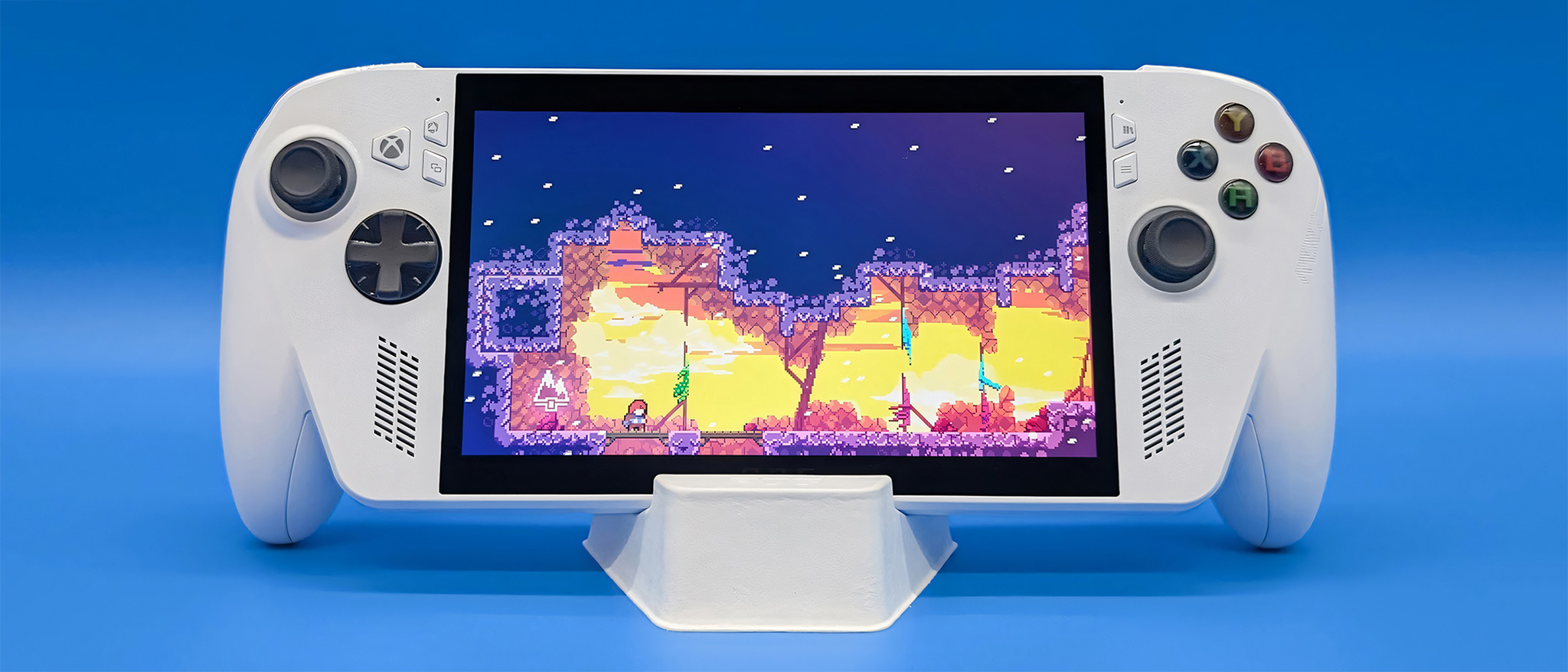 The Xbox Ally held up in its stand and playing Celeste.