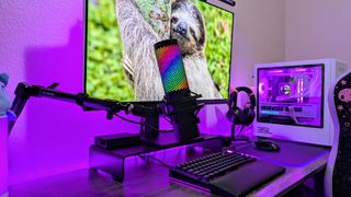 The HyperX QuadCast 2 S mounted on a microphone boom arm.