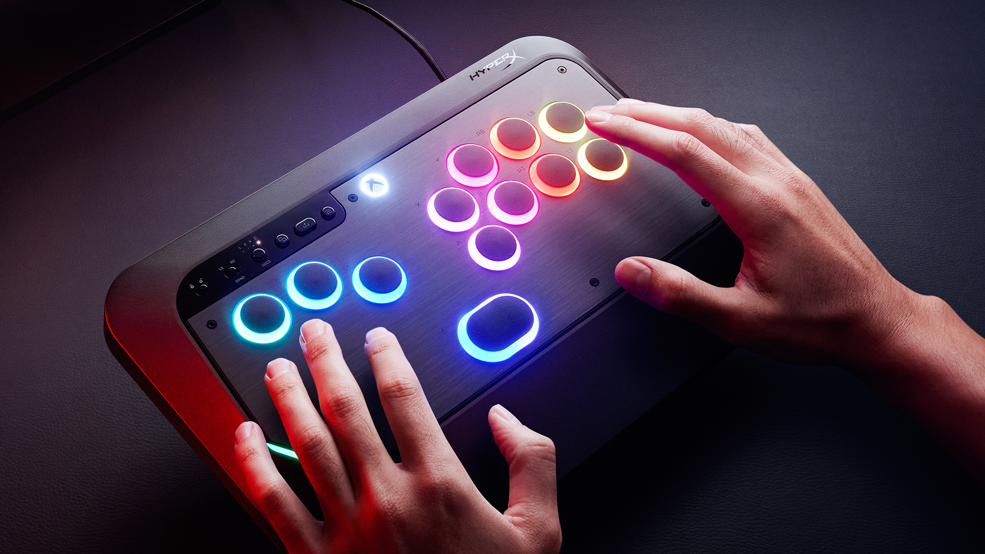 HyperX Clutch Tachi promotional image showing the fighting controller with RGB buttons on a dark desk