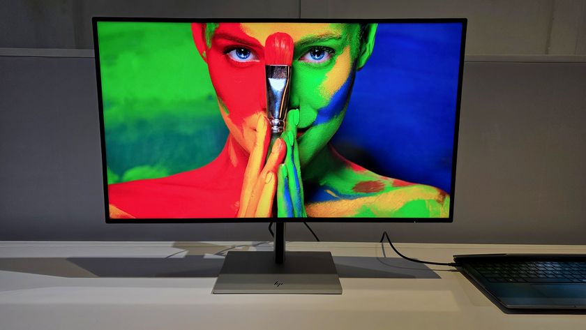 HP Series 7 Pro 4K Monitor showing a colorful image of a woman holding a brush. 